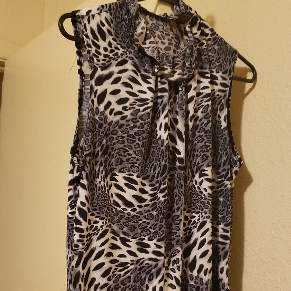 Serenade size Lg. Black and polyester spandex short sleeve animal print blouse